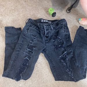 Distressed mid rise skinny jeans